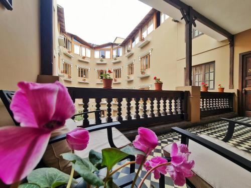 a view of a balcony with pink flowers at Hotel Antigua Miraflores in Lima