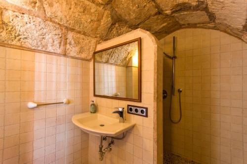 a bathroom with a sink and a mirror at 243 Villa Can Bassa ETV3623 by Mallorca Charme in Muro