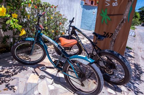 two bikes are parked next to each other at Pousada Vila Barequeçaba in São Sebastião