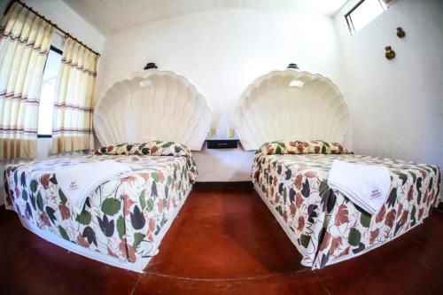 Postel nebo postele na pokoji v ubytování Hotel Albatros