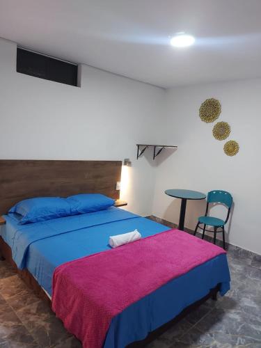 Postel nebo postele na pokoji v ubytování HOTEL DEPARTAMENTAL