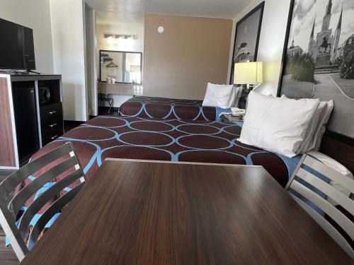 a conference room with a table and chairs at Super 8 by Wyndham Slidell in Slidell