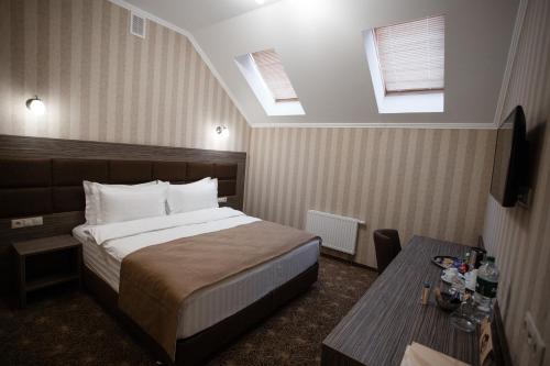Кровать или кровати в номере Отель Родина