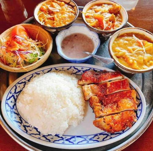 a plate of food with rice and other foods at ZZOKIAI Premier Ou奥武壹号B棟 奥武岛上能看见海的新建一户建 走到海滩只有1分钟 walk to beach only 1 minute in Shikenbaru