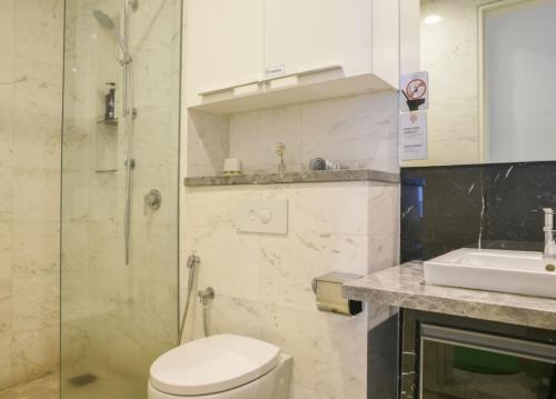 a bathroom with a shower and a toilet and a sink at The Platinum KLCC in Kuala Lumpur