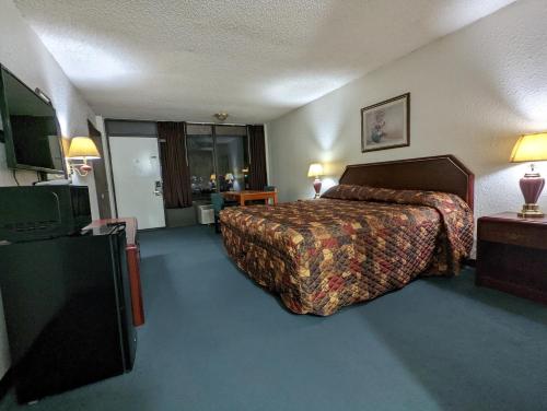 Ένα ή περισσότερα κρεβάτια σε δωμάτιο στο Luxury inn