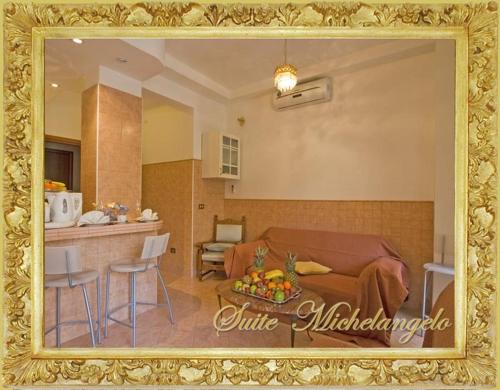a living room and kitchen with a couch and a table at B&B Babri Simim Taj in Rome