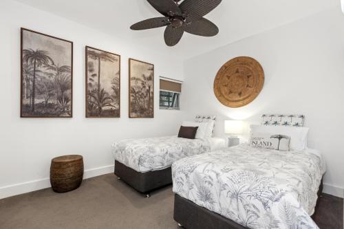 Ένα ή περισσότερα κρεβάτια σε δωμάτιο στο Cotton Beach Resort - Tweed Coast Holidays ®