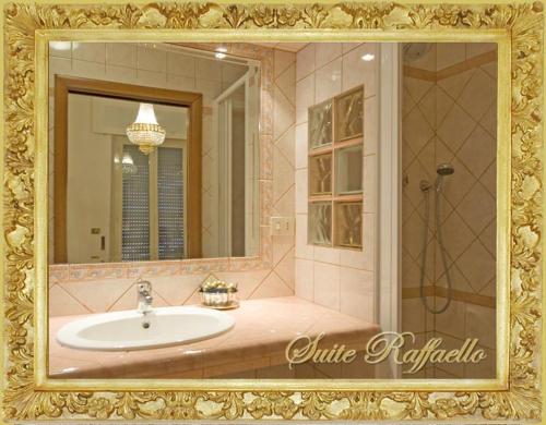 a bathroom with a sink and a mirror at B&B Babri Simim Taj in Rome