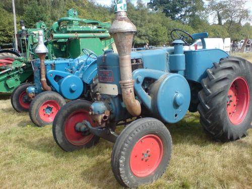 a group of tractors parked in a field at Les Roulottes de la Risle in Calleville