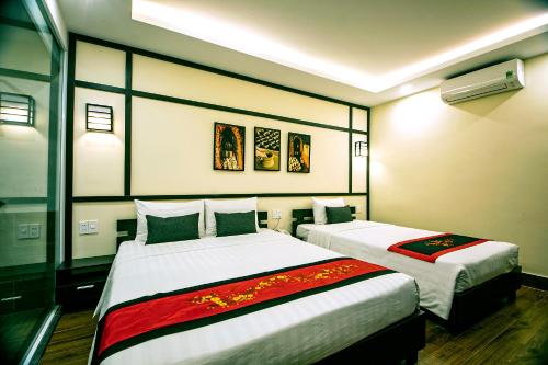 Postel nebo postele na pokoji v ubytování Hoi An Riverland Villa - Hoi An Center