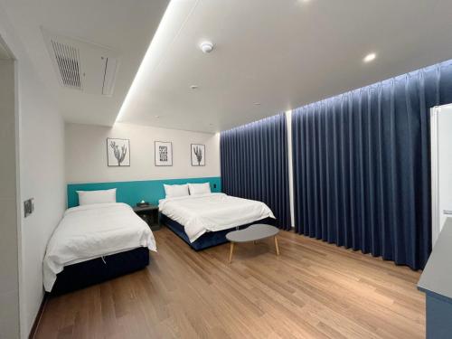 Postel nebo postele na pokoji v ubytování GD Hotel