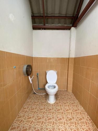 a bathroom with a toilet in a stall at JJ&J Garden in Pai