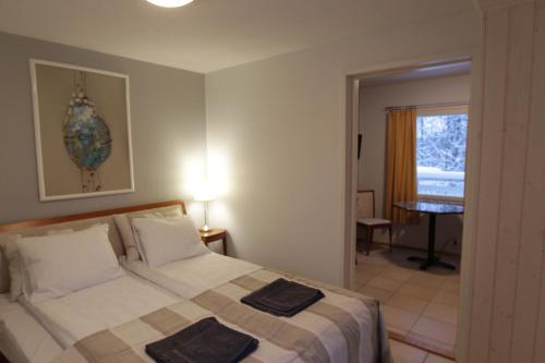 Cama o camas de una habitación en Hotel Urkin Piilopirtti