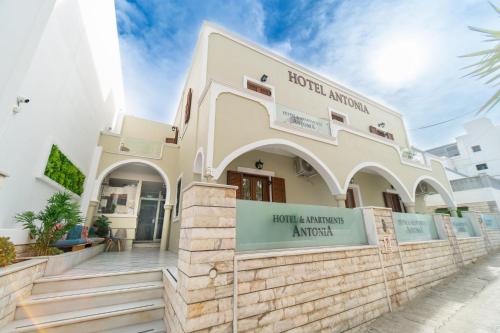a building with a sign in front of it at Antonia Hotel in Fira