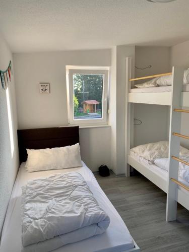 Katil atau katil-katil dalam bilik di Ferienhaus - Heimathafen Tossens