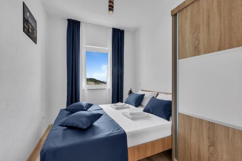 Кровать или кровати в номере Apartments Lujnovic