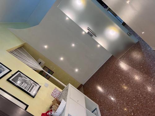 a kitchen with a ceiling with lights on it at Casa Riri in San Benedetto del Tronto