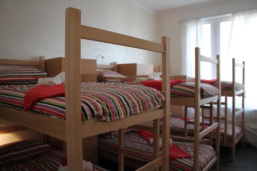 a group of bunk beds in a room at Guest House Miss Depolo in Belgrade