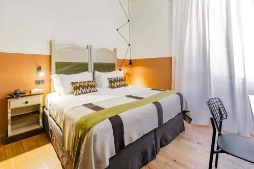 מיטה או מיטות בחדר ב-Hotel Priori Secret Garden