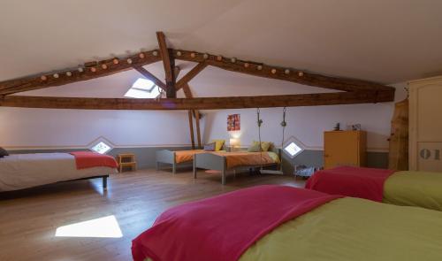 A bed or beds in a room at Domaine de Quintalone