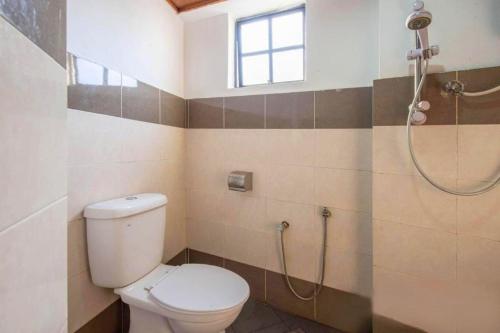 a bathroom with a toilet and a shower at GS Golden Star Hotel in Seri Kembangan