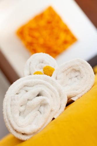 a piece of bread with white frosting on a plate at Palazzo Ferrucci Luxury Suites in Cagliari