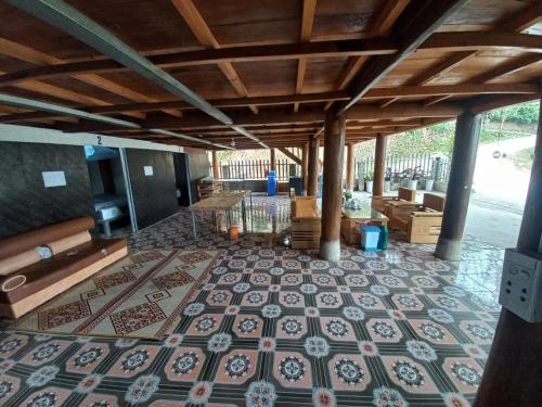 a large room with a tile floor in a house at Homestay Hoàng Vũ in Ha Giang