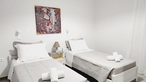 Postel nebo postele na pokoji v ubytování PIERI HOUSE CORFU