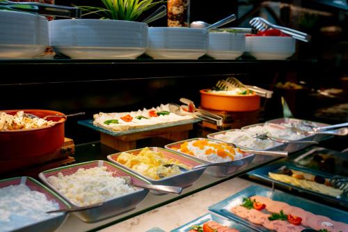 a buffet line with many different types of food at Promenade Hotel Baku in Baku
