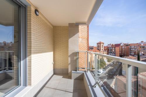 a balcony with a view of a city at INSIDEHOME Ciudad de Valladolid in Valladolid