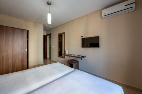 Una cama o camas en una habitación de Hotel Etoile Du Nord