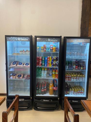 two refrigerators are standing next to each other at Sítio Maravilha em Domigos Martins in Domingos Martins