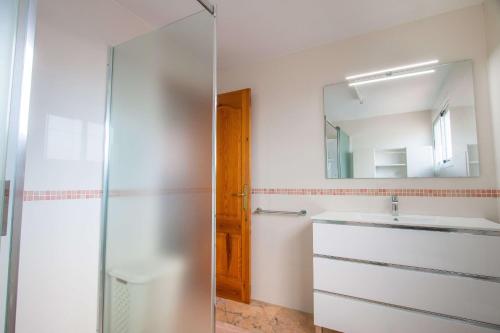 a bathroom with a sink and a mirror at Villa Corina - Plusholidays in Calpe
