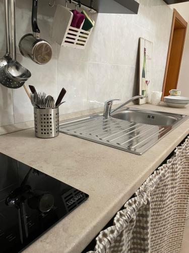 a kitchen counter with a sink and a counter top at Casa Buena Vida (locazione ad uso turistico) in Monopoli