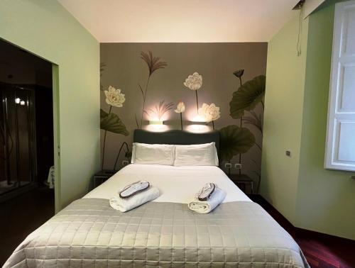 מיטה או מיטות בחדר ב-Dolce Vita Guest House