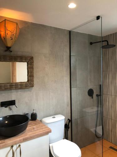 a bathroom with a toilet and a sink and a shower at Botë Farms Agriturismo in Sarandë