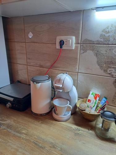 a kitchen counter with a coffee maker and a blender at Etno house HAPPY VILLAGE in Cetinje