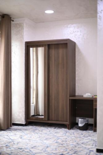a wooden door in the middle of a room at The Castle Hotel in Amman