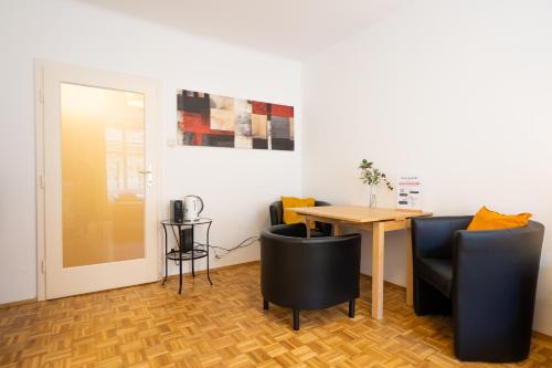 a dining room with a table and chairs at Central living - Stephansdom Apartments in Vienna