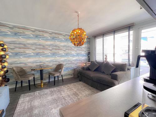 a living room with a large wave mural on the wall at Duen12 21 Magic Beach in Westerland
