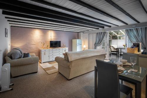 a living room with two couches and a table at Cottage - Sleeps4 - PetFriendly - Garden - ByBeach in Saint Annes on the Sea