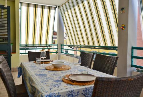 a table with a bowl on top of it on a balcony at Il Sestante Santa Marinella in Santa Marinella
