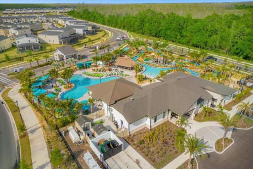 an aerial view of a pool at a resort at Stylish Resort Villa w Pool Near Disney Gated 5BR in Kissimmee