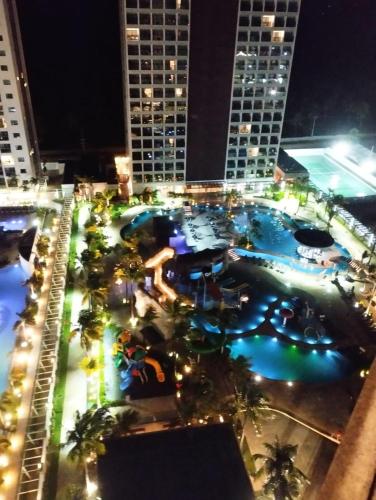 an aerial view of a swimming pool at night at Salinas Premium Resort in Salinópolis