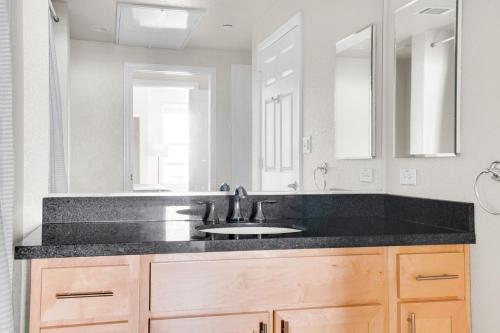 a bathroom with a sink and a mirror at San Bruno 1BR w Pool Gym WD nr highways SFO-995 in San Bruno