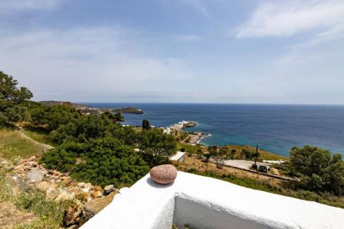 a view of the ocean from the roof of a house at Pauvre Maison with sea View in Chrisopigi