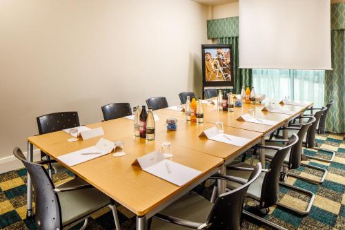 a large conference room with a long table and chairs at Mercure Sheffield Parkway in Sheffield
