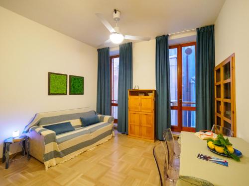 a living room with a bed and a couch at Casa Pina Quiet Apartment in Vernazza