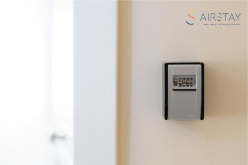 an electrical outlet on the wall of a room at Elise Apartment Airport by Airstay in Spáta